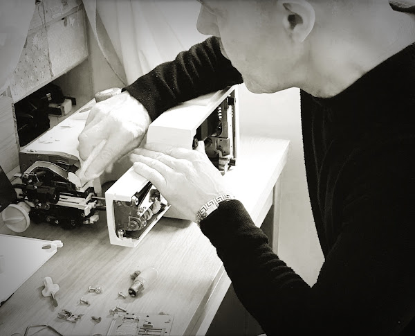 Mark Evans Repairing a Sewing Machine